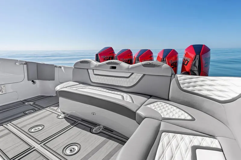 Slide: The Image of 2024 MTI V42 boat interior with luxurious seating and powerful outboard engines. - 80