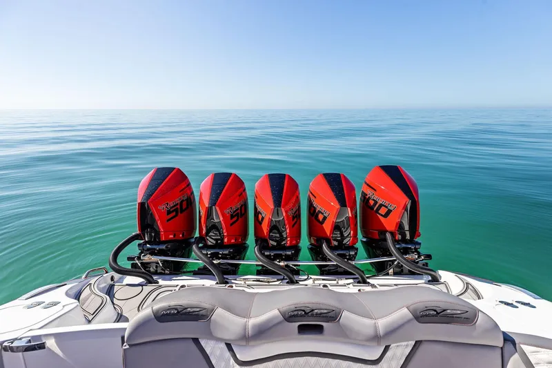 Slide: The Image of 2024 MTI V42 boat with five powerful outboard engines on calm sea. - 81