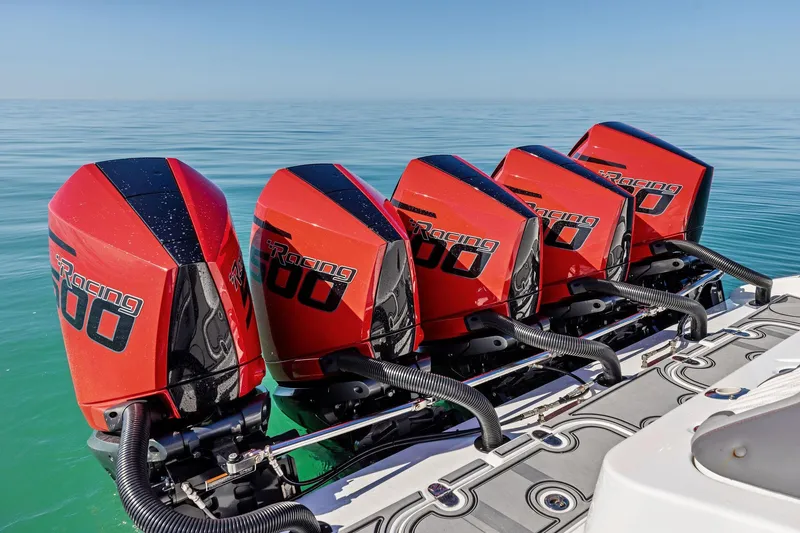 Slide: The Image of Four red racing outboard motors on MTI V42 boat, 2024 model, on calm sea. - 83