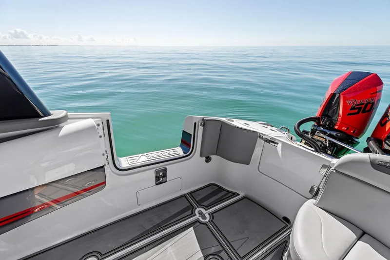 Slide: The Image of 2024 MTI V42 boat interior with twin outboard engines on calm sea. - 87