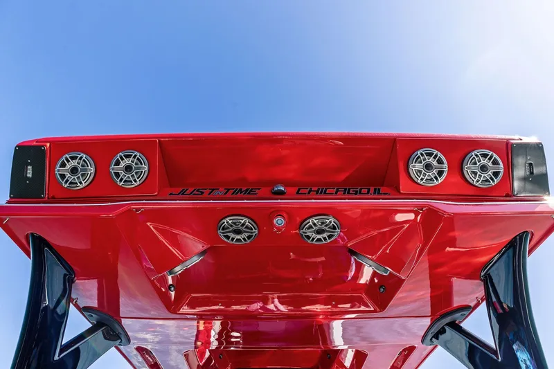 Slide: The Image of Red MTI V42 boat, 2024 model, with speakers and "Just in Time Chicago, IL" text. - 89