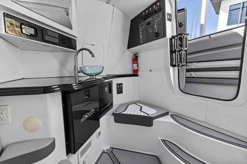 Slide: The Image of 2024 MTI V42 boat interior with modern kitchenette and control panel. - 92