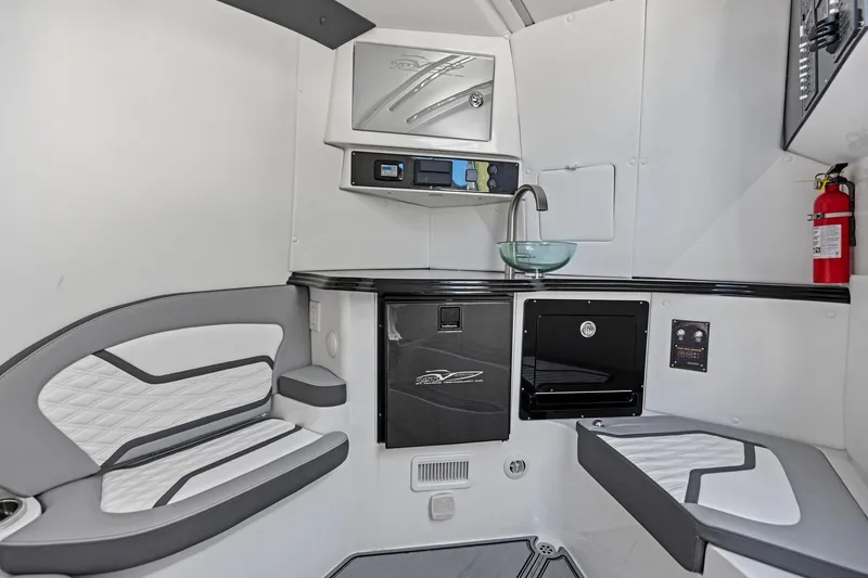 Slide: The Image of Luxurious interior of 2024 MTI V42 boat with seating, sink, and fire extinguisher. - 93