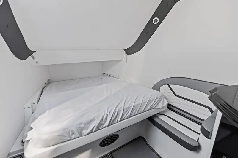 Slide: The Image of 2024 MTI V42 interior cabin with a compact bed and modern design. - 95