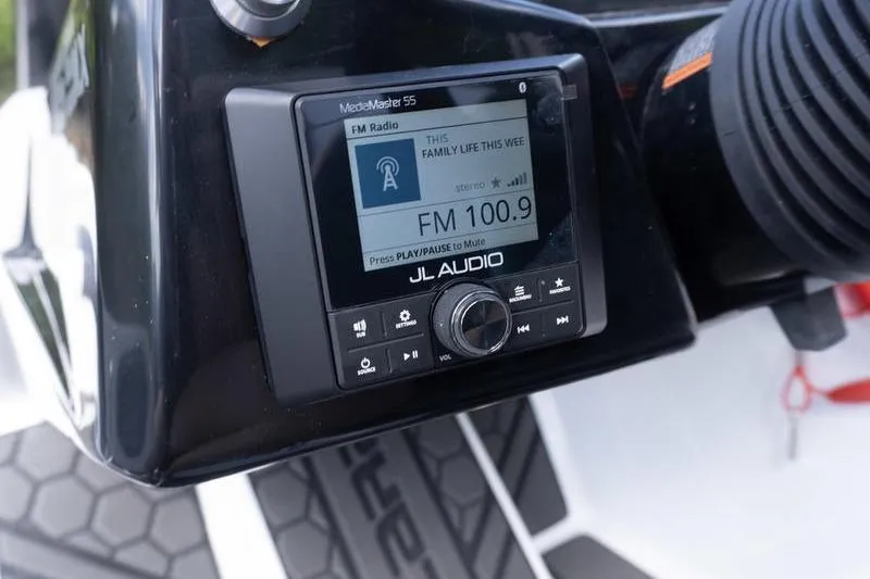Slide: The Image of JL Audio MediaMaster 55 radio on 2026 Scarab 165 LX boat dashboard. - 10