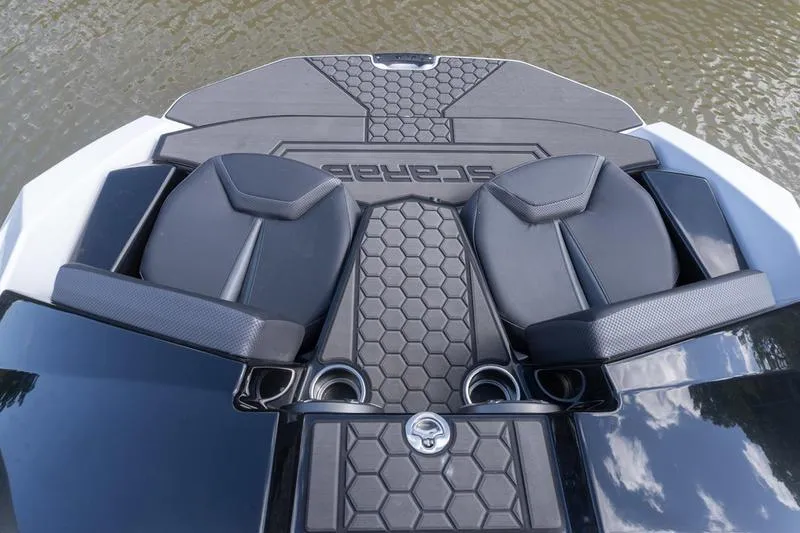 Slide: The Image of 2026 Scarab 165 LX boat with stylish seating and hexagonal pattern design. - 12