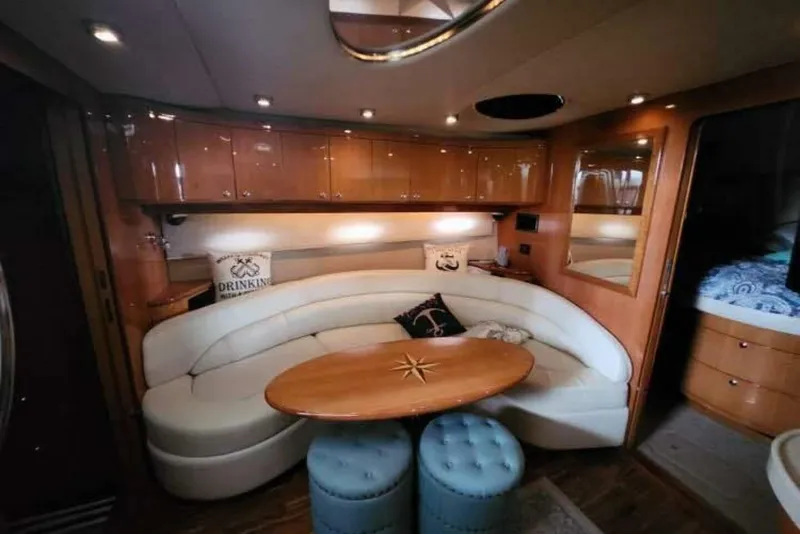 Slide: The Image of Luxurious interior of 2007 Regal Commodore 4460 yacht with elegant seating and wooden accents. - 11