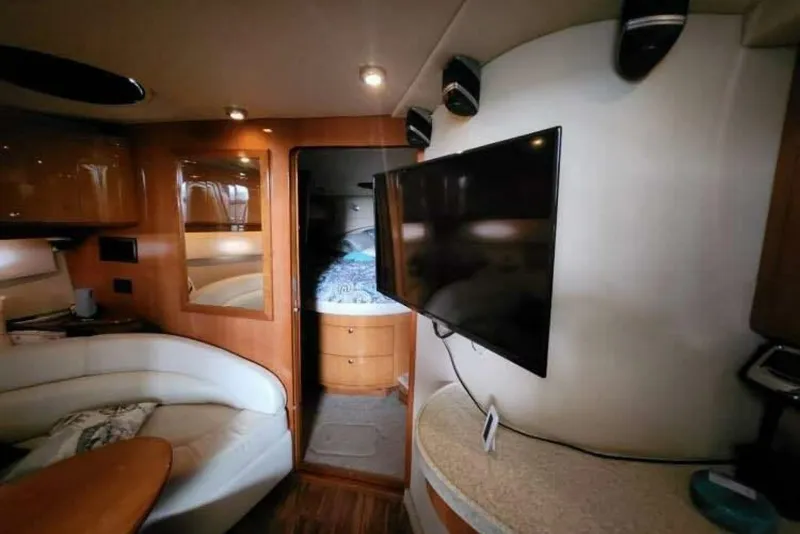 Slide: The Image of Interior of 2007 Regal Commodore 4460 yacht with cozy seating and modern amenities. - 12
