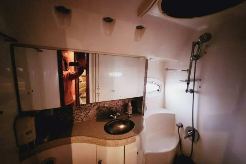 Slide: The Image of Luxurious bathroom in 2007 Regal Commodore 4460 yacht with modern fixtures and elegant design. - 17