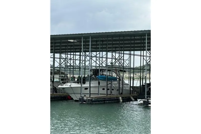 Slide: The Image of 2007 Regal Commodore 4460 yacht docked in a covered marina. - 6