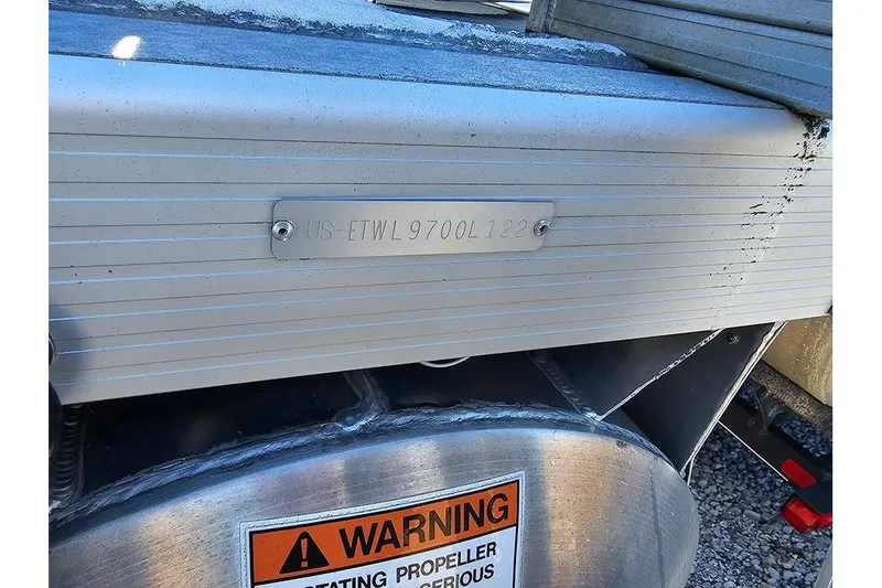 Slide: The Image of 2022 Bennington 22SF boat hull with warning label and serial number plate. - 14