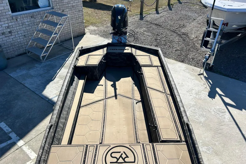 Slide: The Image of 2025 Havoc 1860 Dbst boat with sleek design and modern features, parked outdoors. - 11