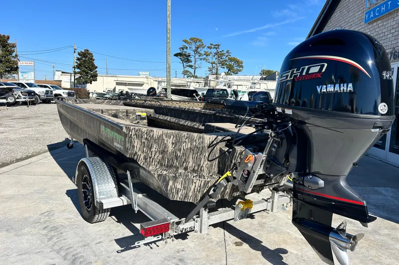 Slide: The Image of 2025 Havoc 1860 Dbst boat with Yamaha engine on trailer, parked outdoors. - 3