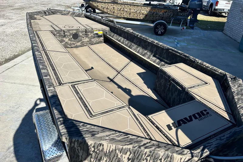Slide: The Image of 2025 Havoc 1860 Dbst boat with camouflage design on a trailer. - 9