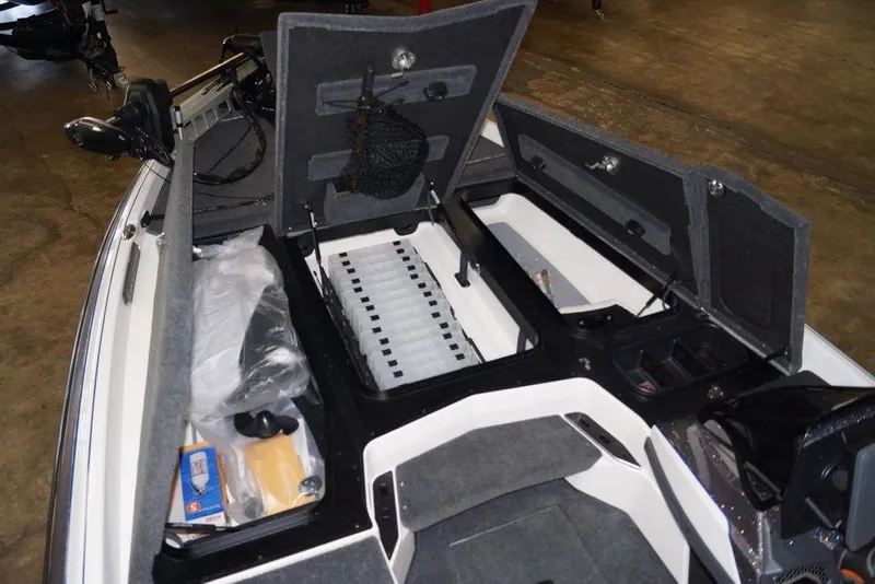 Slide: The Image of 2026 Skeeter FXR20 FLEX boat interior with open storage compartments and equipment. - 15