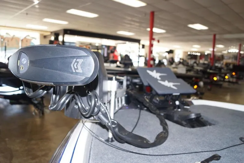 Slide: The Image of 2026 Skeeter FXR20 FLEX boat in showroom, featuring advanced trolling motor. - 17