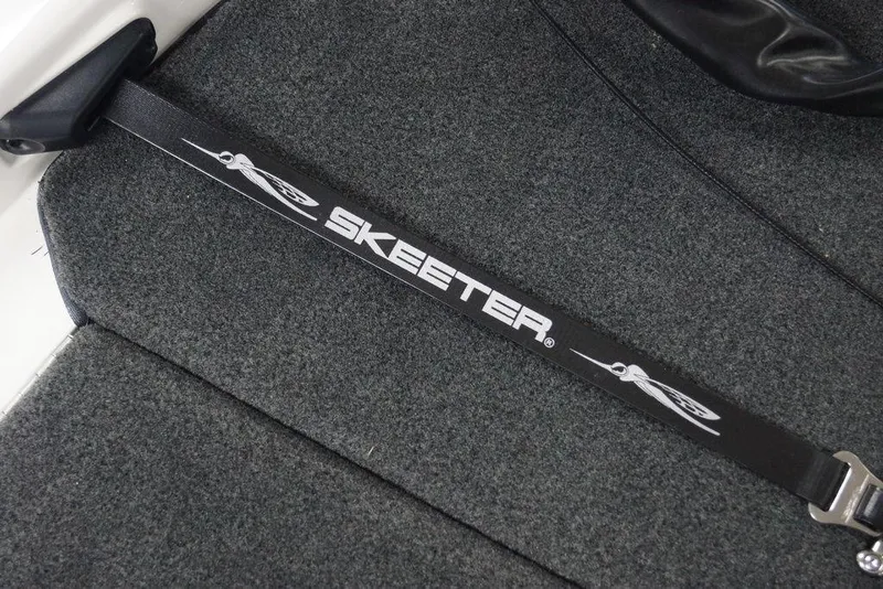 Slide: The Image of Skeeter FXR20 FLEX 2026 boat strap on gray carpeted surface. - 19