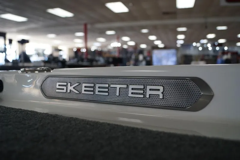 Slide: The Image of 2026 Skeeter FXR20 FLEX boat logo in showroom setting. - 21