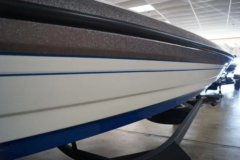 Slide: The Image of 2026 Skeeter FXR20 FLEX boat hull with sleek design and blue accents. - 29