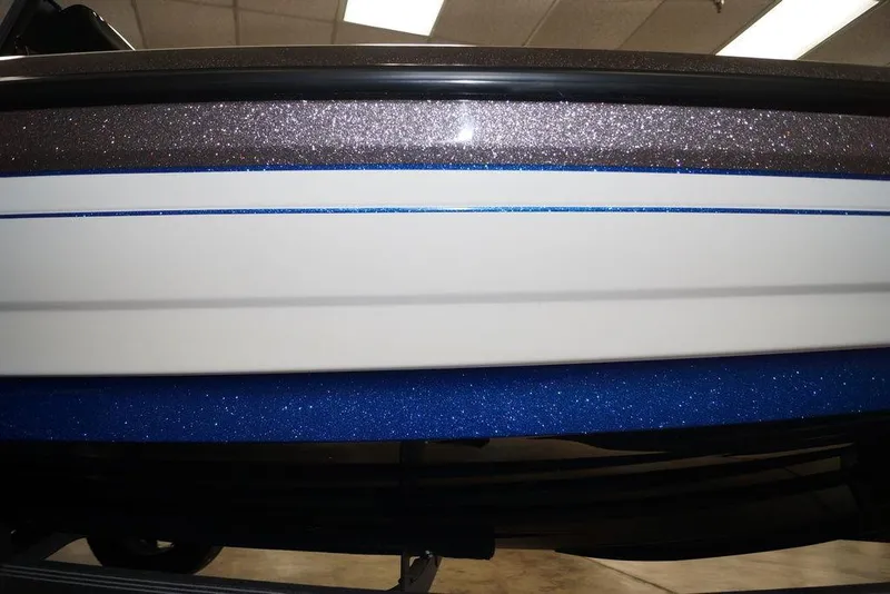 Slide: The Image of 2026 Skeeter FXR20 FLEX boat with glittery blue and brown detailing. - 30