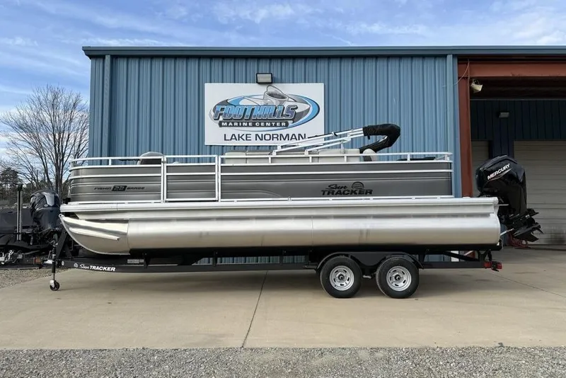 The Image of 2026 Sun Tracker Fishin' Barge 22 DLX pontoon boat at Foothills Marine Center. - 0