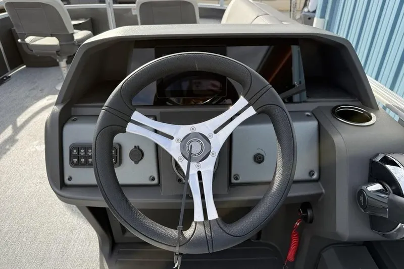 Slide: The Image of Steering console of 2026 Sun Tracker Fishin' Barge 22 DLX pontoon boat. - 13