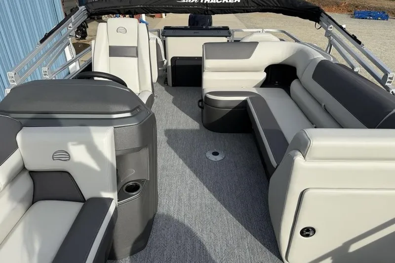 Slide: The Image of 2026 Sun Tracker Fishin' Barge 22 DLX interior with spacious seating and modern design. - 15