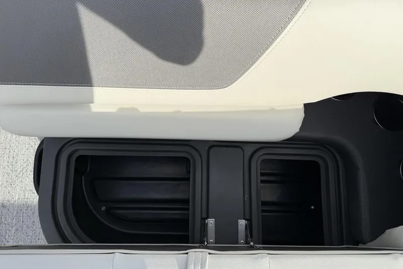 Slide: The Image of Storage compartment in 2026 Sun Tracker Fishin' Barge 22 DLX boat, featuring dual sections. - 18