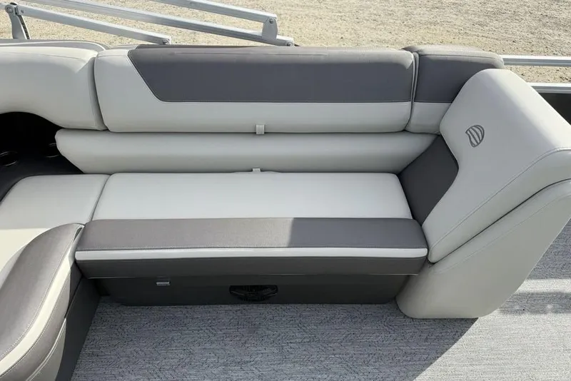 Slide: The Image of 2026 Sun Tracker Fishin' Barge 22 DLX, gray and white seating detail. - 22