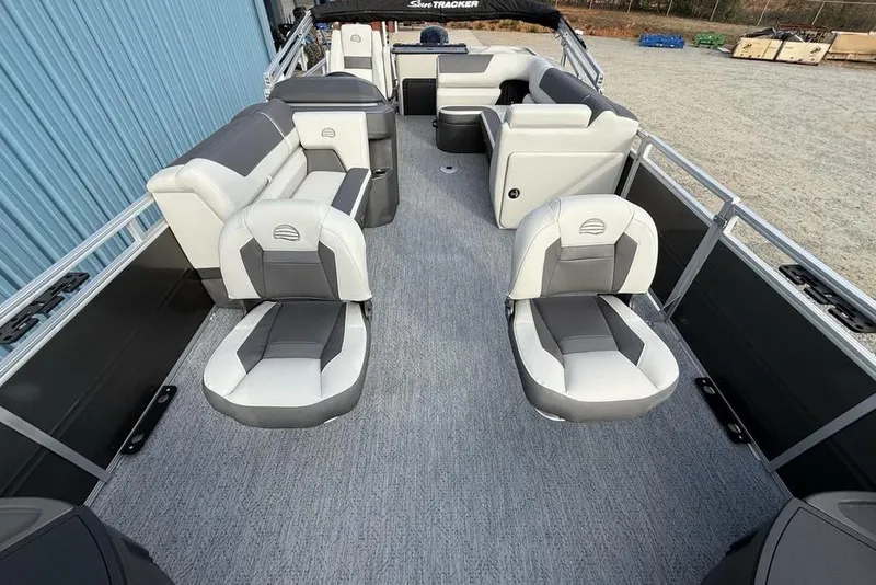 Slide: The Image of 2026 Sun Tracker Fishin' Barge 22 DLX interior with spacious seating and modern design. - 33