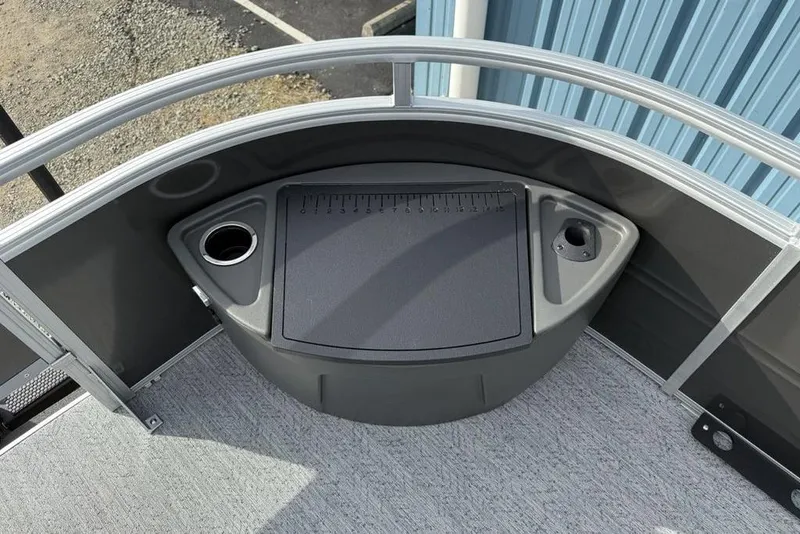 Slide: The Image of 2026 Sun Tracker Fishin' Barge 22 DLX deck with cup holder and storage. - 5