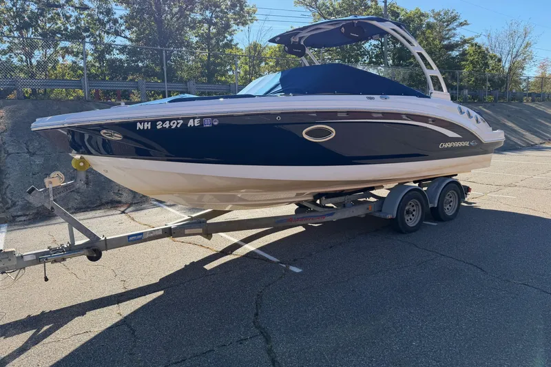 Slide: The Image of 2016 Chaparral 246 SSi boat on trailer in parking lot, sunny day. - 16