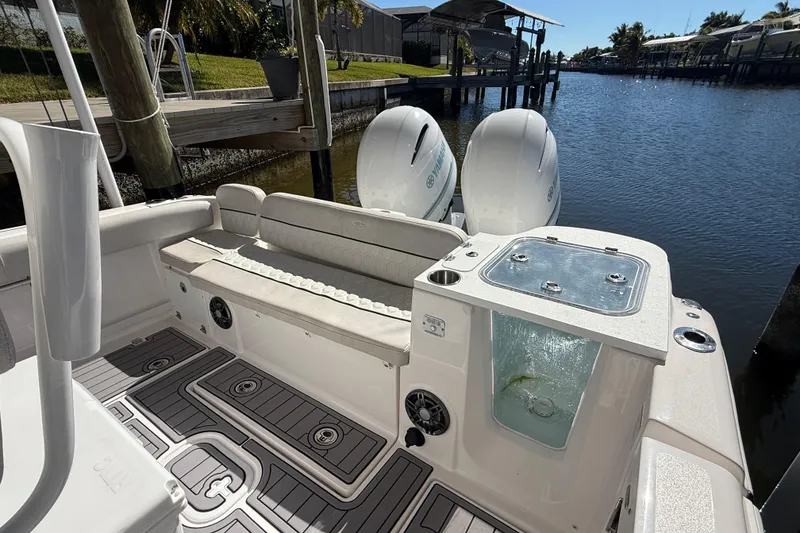 Slide: The Image of 2023 Sea Fox 268 Commander boat interior with dual engines and seating area. - 10