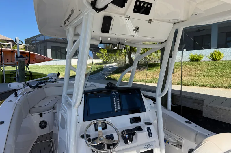Slide: The Image of 2023 Sea Fox 268 Commander boat interior with modern dashboard and steering wheel. - 14