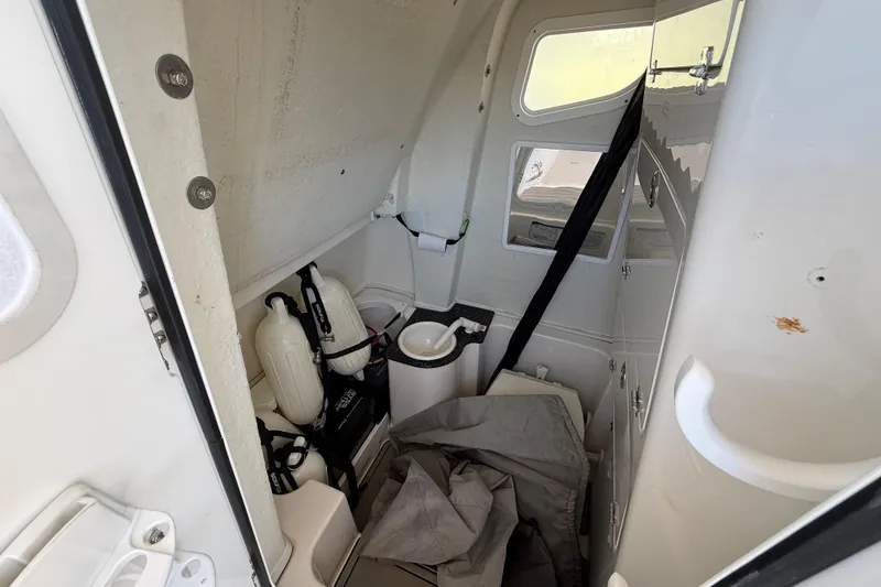 Slide: The Image of Interior of 2023 Sea Fox 268 Commander boat, featuring storage and safety equipment. - 24