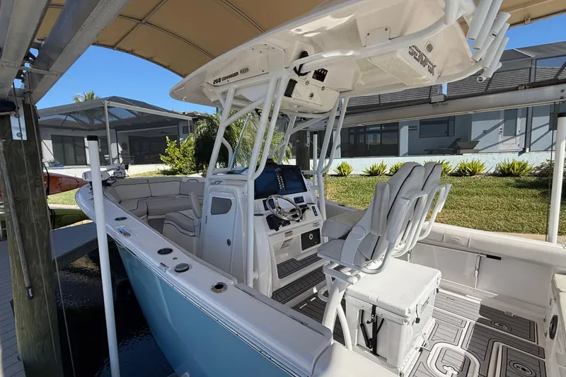 Slide: The Image of 2023 Sea Fox 268 Commander boat with modern helm and seating under canopy. - 3