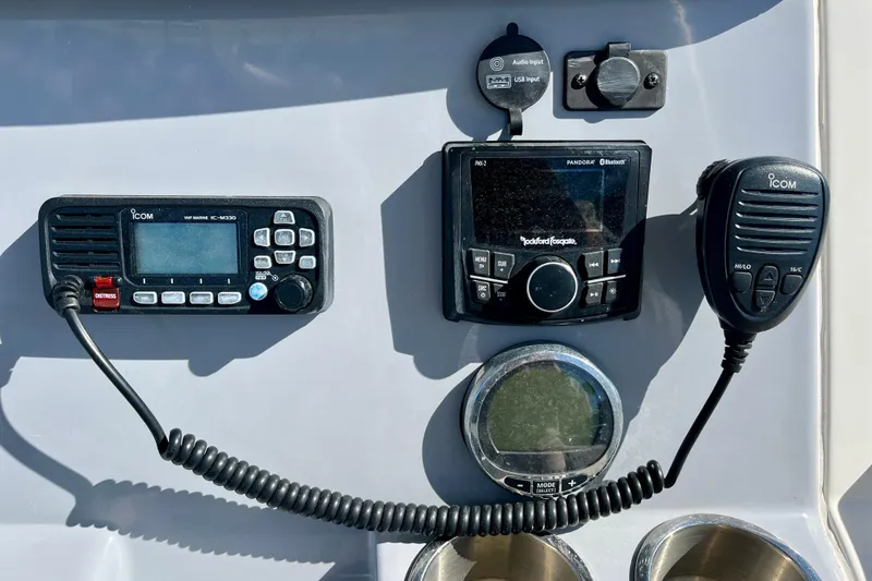 Slide: The Image of Control panel of 2023 Trophy T24CC boat with Icom marine radio and audio system. - 21