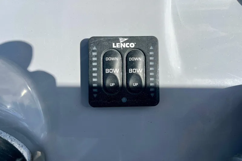 Slide: The Image of Lenco trim tab control panel on 2023 Trophy T24CC boat dashboard. - 23
