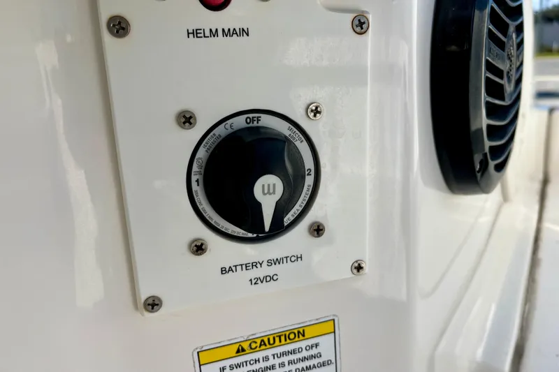 Slide: The Image of Battery switch panel on 2023 Trophy T24CC boat, featuring helm main control. - 30