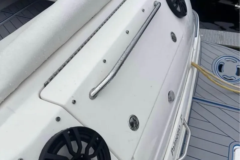 Slide: The Image of 2001 Sea Ray 340 Sundancer boat deck with speakers and railing. - 2