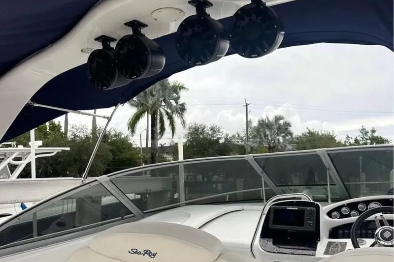 Slide: The Image of 2001 Sea Ray 340 Sundancer boat interior with speakers and navigation equipment. - 3