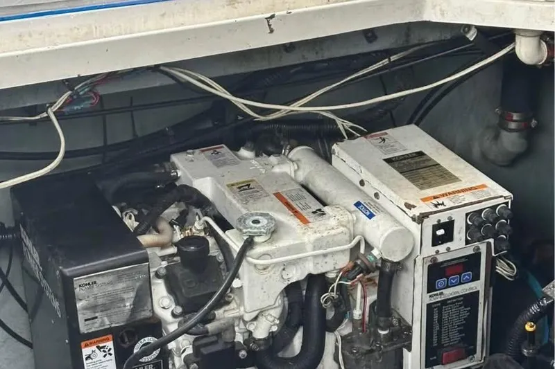 Slide: The Image of Engine compartment of a 2001 Sea Ray 340 Sundancer boat, showing mechanical components. - 8