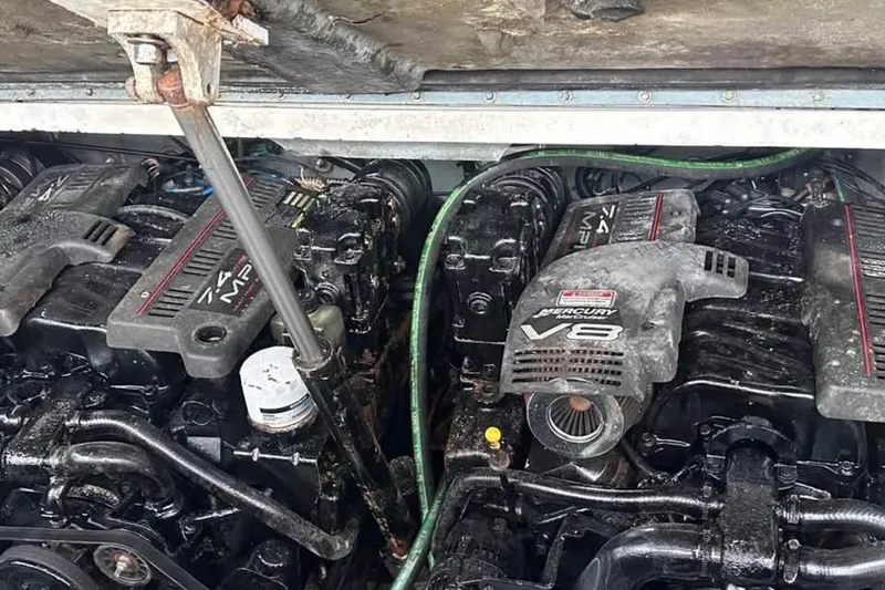 Slide: The Image of Engine compartment of a 2001 Sea Ray 340 Sundancer with dual Mercury V8 engines. - 9