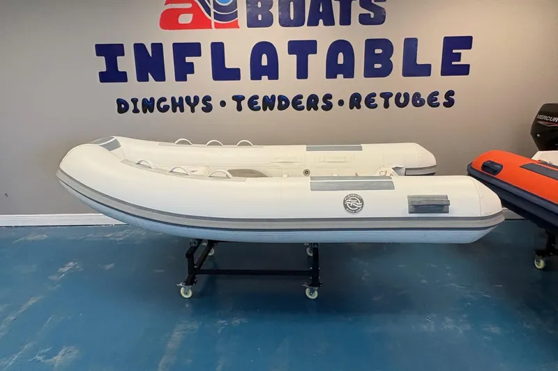 The Image of 2024 Flexboat SR-10 inflatable boat displayed at a showroom with contact information. - 0