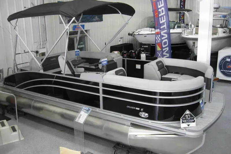 The Image of 2024 Harris FloteBote Cruiser 210 pontoon boat with canopy in a studio setting. - 0