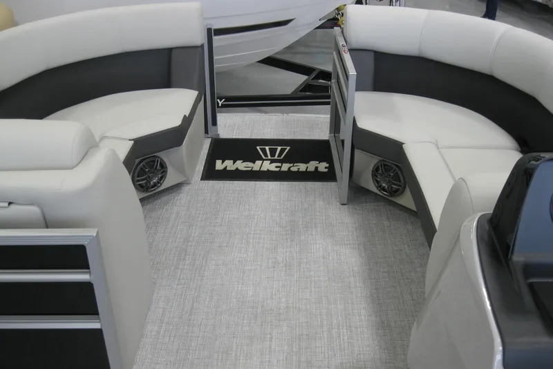 Slide: The Image of 2024 Harris FloteBote Cruiser 210 interior with gray seating and built-in speakers. - 10