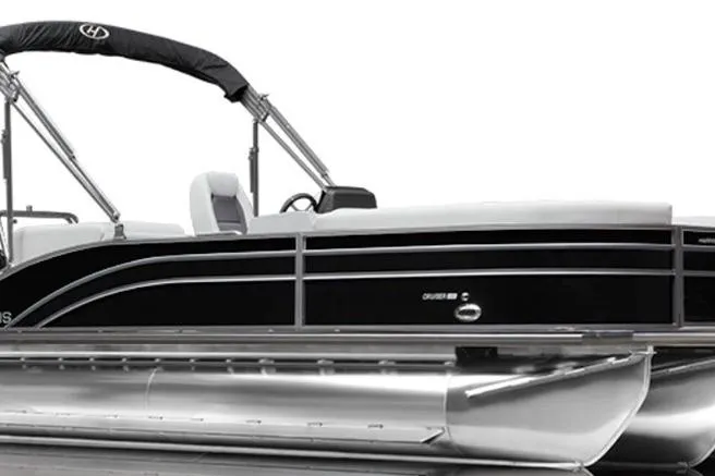 Slide: The Image of 2024 Harris FloteBote Cruiser 210 pontoon boat with sleek black design and canopy. - 13