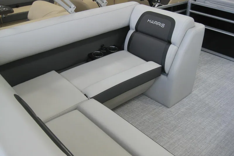Slide: The Image of 2024 Harris FloteBote Cruiser 210 interior seating with elegant design and cup holders. - 6