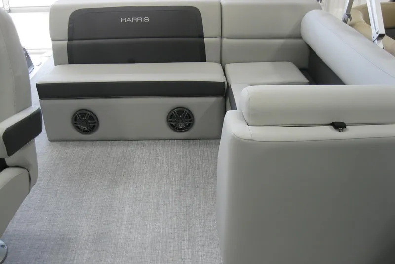Slide: The Image of 2024 Harris FloteBote Cruiser 210 captain's chair and steering wheel interior. - 9