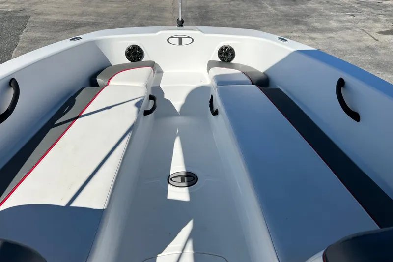 Slide: The Image of 2022 Tahoe T18 boat interior with white seating and black accents. - 11